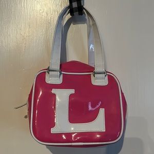 Precious! Adorable! Cute! Pink and white vinyl bag with LOVE spelled on the side